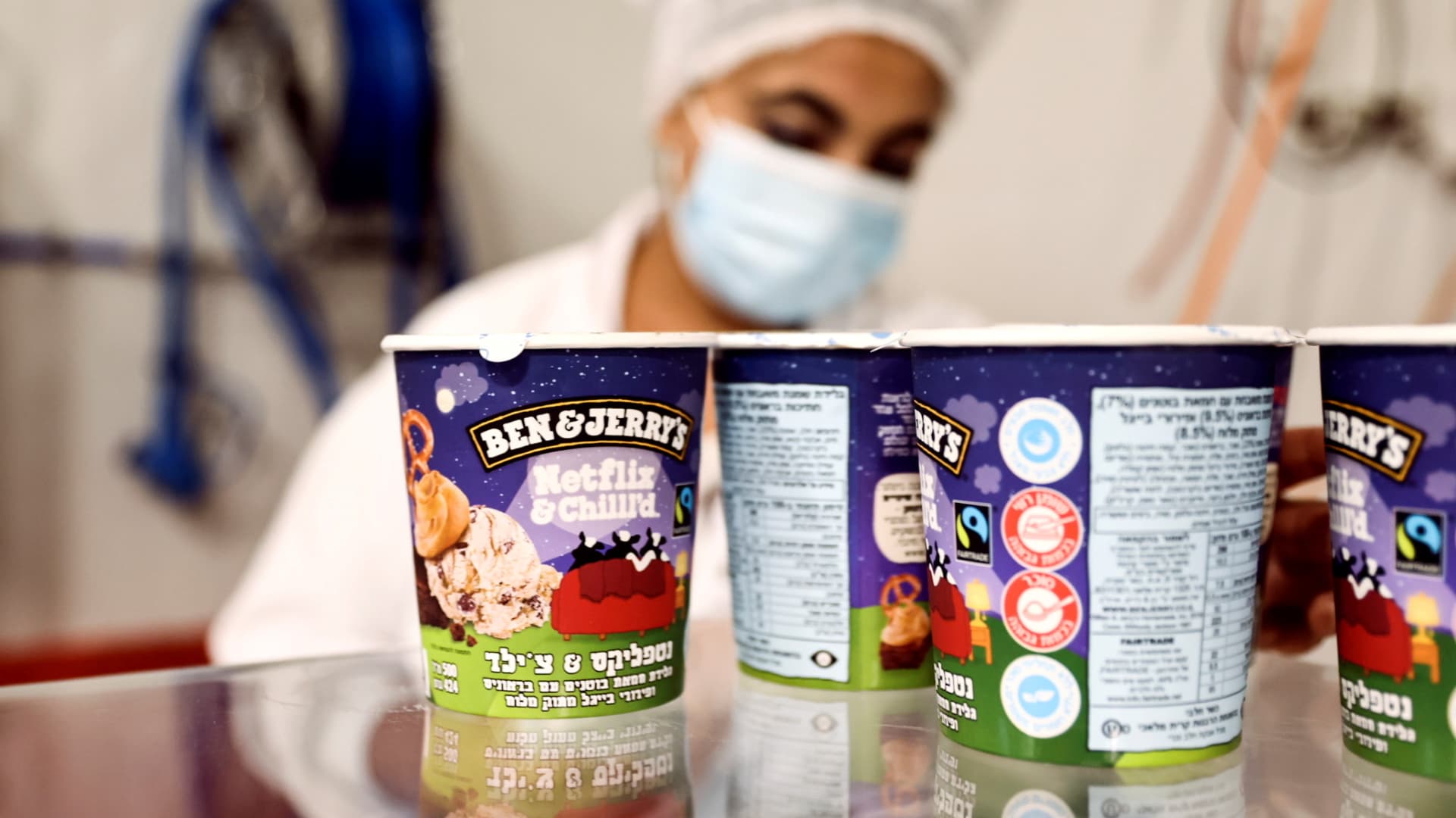 Tubs of ice-cream are seen as a laborer works at Ben & Jerry's factory in Be'er Tuvia, Israel July 20, 2021.