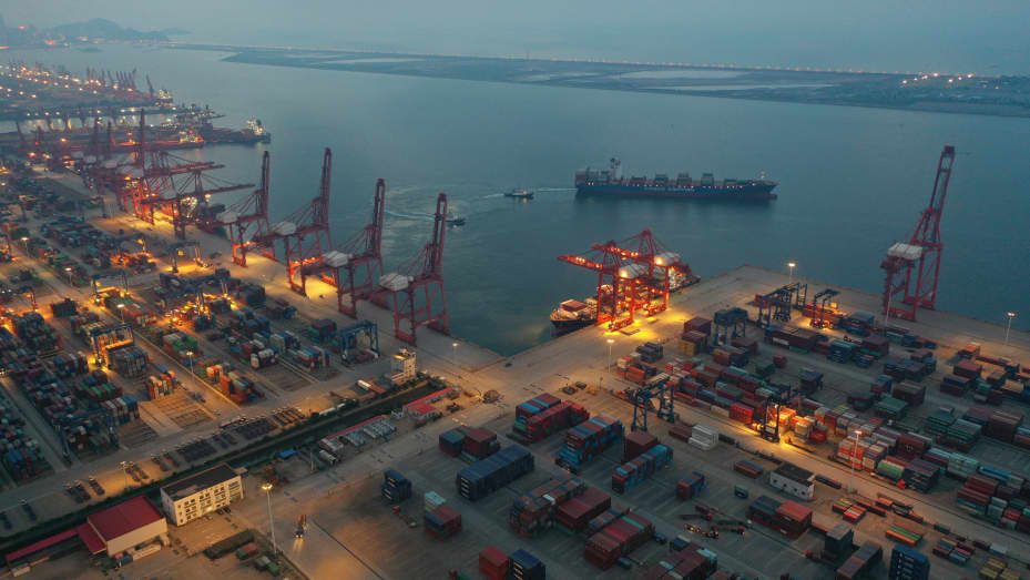 A ship leaves a container port in the evening in Lianyungang in east China's Jiangsu province Thursday, July 22, 2021.