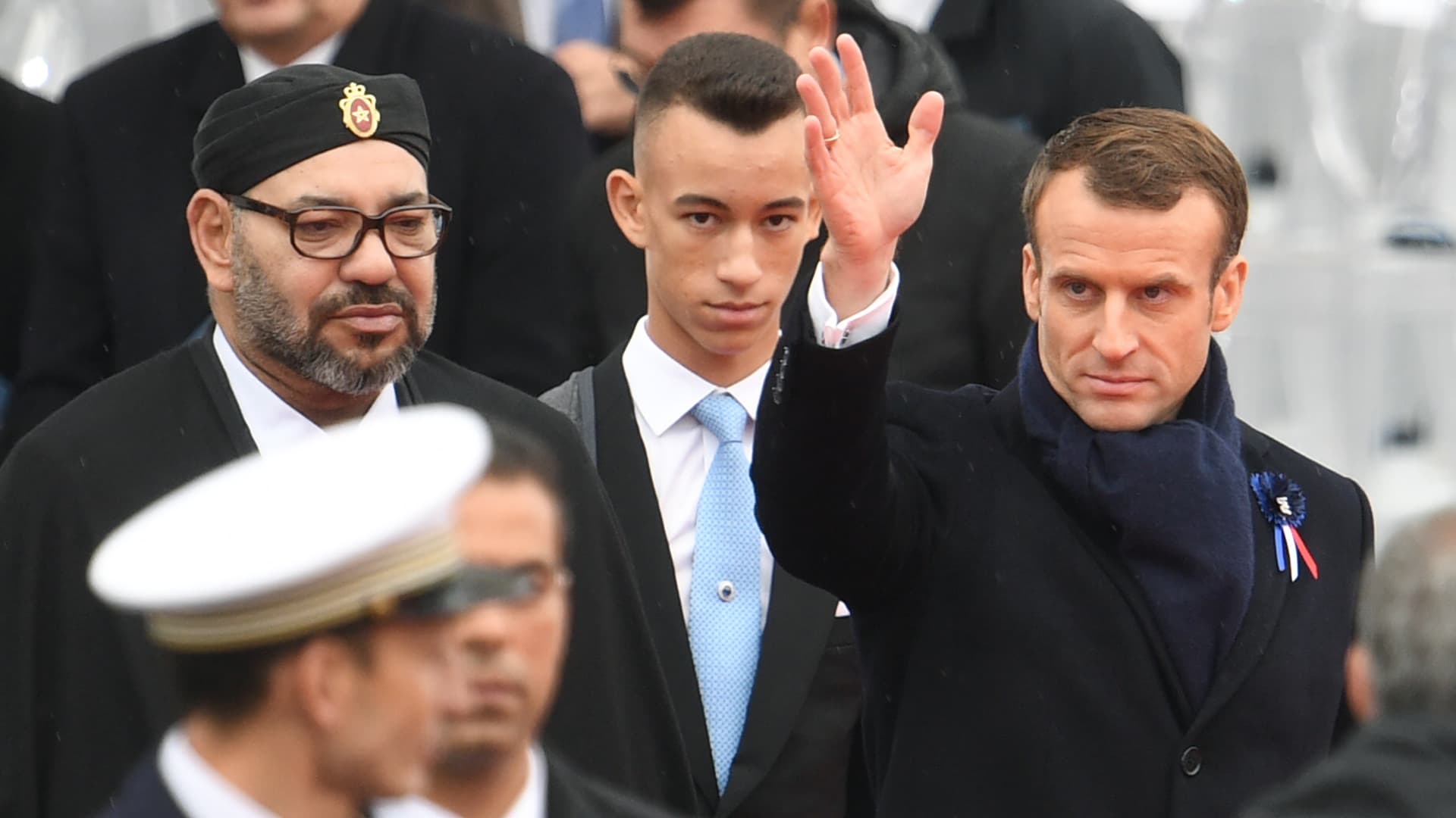 PARIS - French President Emmanuel Macron (R) waves as he leaves with Morocco's Prince Moulay Hassan (C) nd Moroccan King Mohammed VI (L) after attending a ceremony at the Arc de Triomphe in Paris on November 11, 2018.