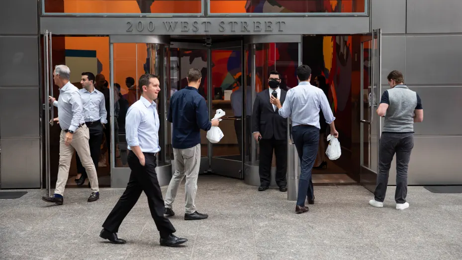 People enter the Goldman Sachs headquarters building in New York, U.S., on Monday, June 14, 2021.