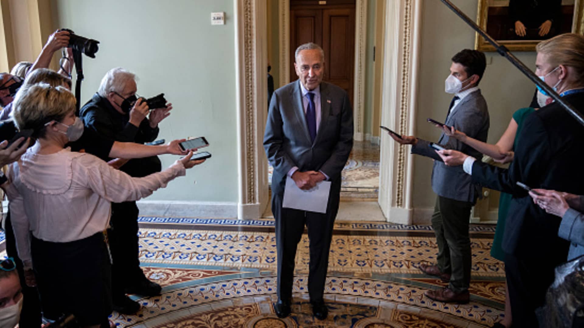 Senate Majority Leader Chuck Schumer (D-NY) speaks briefly to reporters after a meeting with Senate Democrats at the U.S. Capitol on July 28, 2021 in Washington, DC.