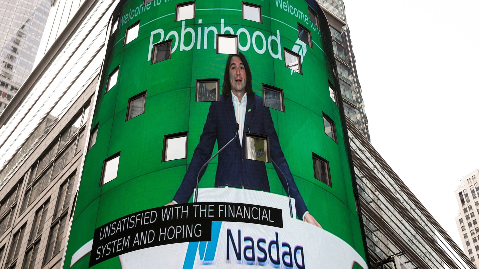 Vlad Tenev, CEO and co-founder Robinhood Markets, Inc., is displayed on a screen during his company’s IPO at the Nasdaq Market site in Times Square in New York City, U.S., July 29, 2021.