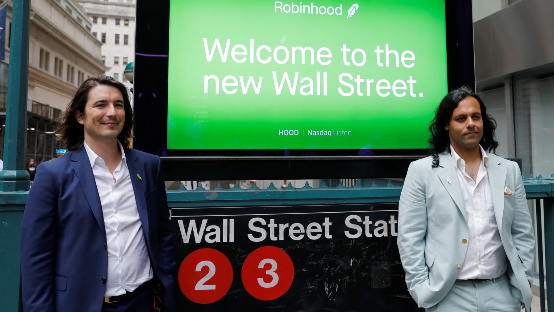 Robinhood Markets, Inc. CEO and co-founder Vlad Tenev and co-founder Baiju Bhatt pose with Robinhood signage on Wall Street after the company's IPO in New York City, U.S., July 29, 2021.