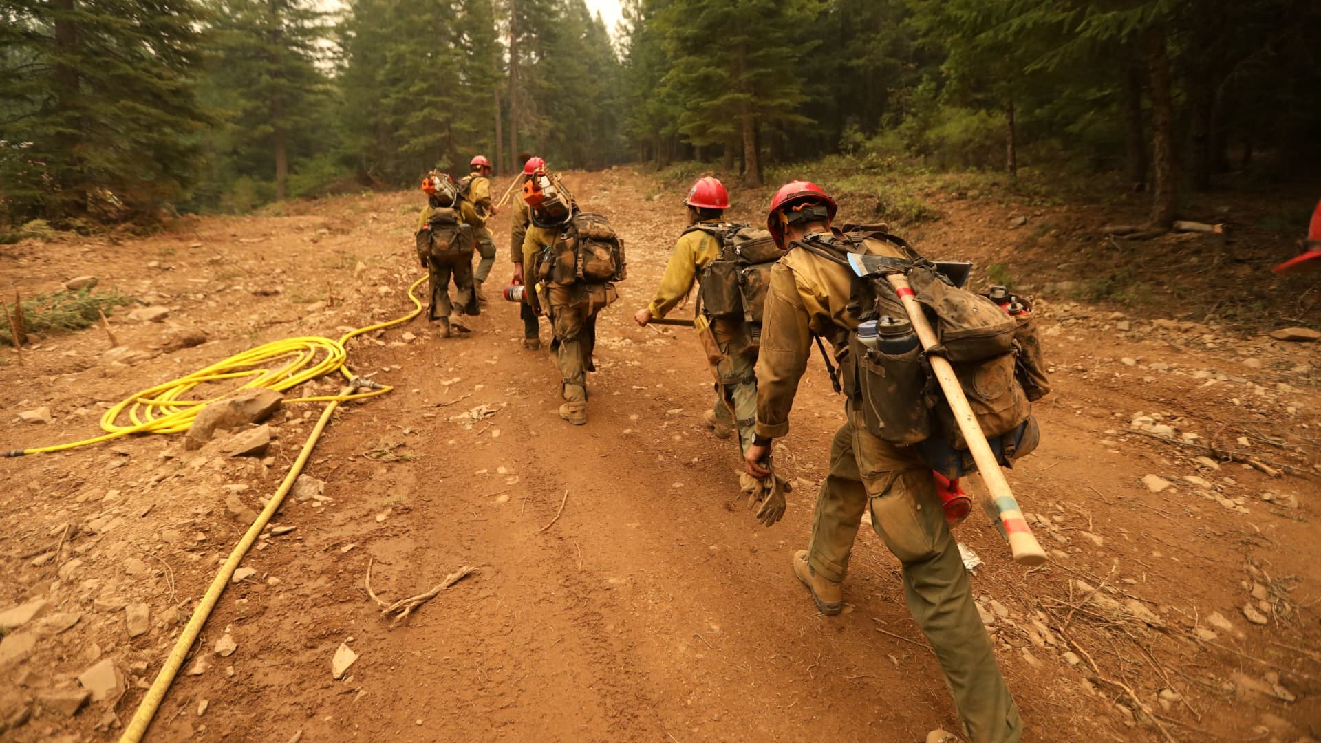 A hotshot crew from Redding with a strike team from the LAFD work the Dixie Fire near Taylorsville, California, U.S., July 29, 2021.