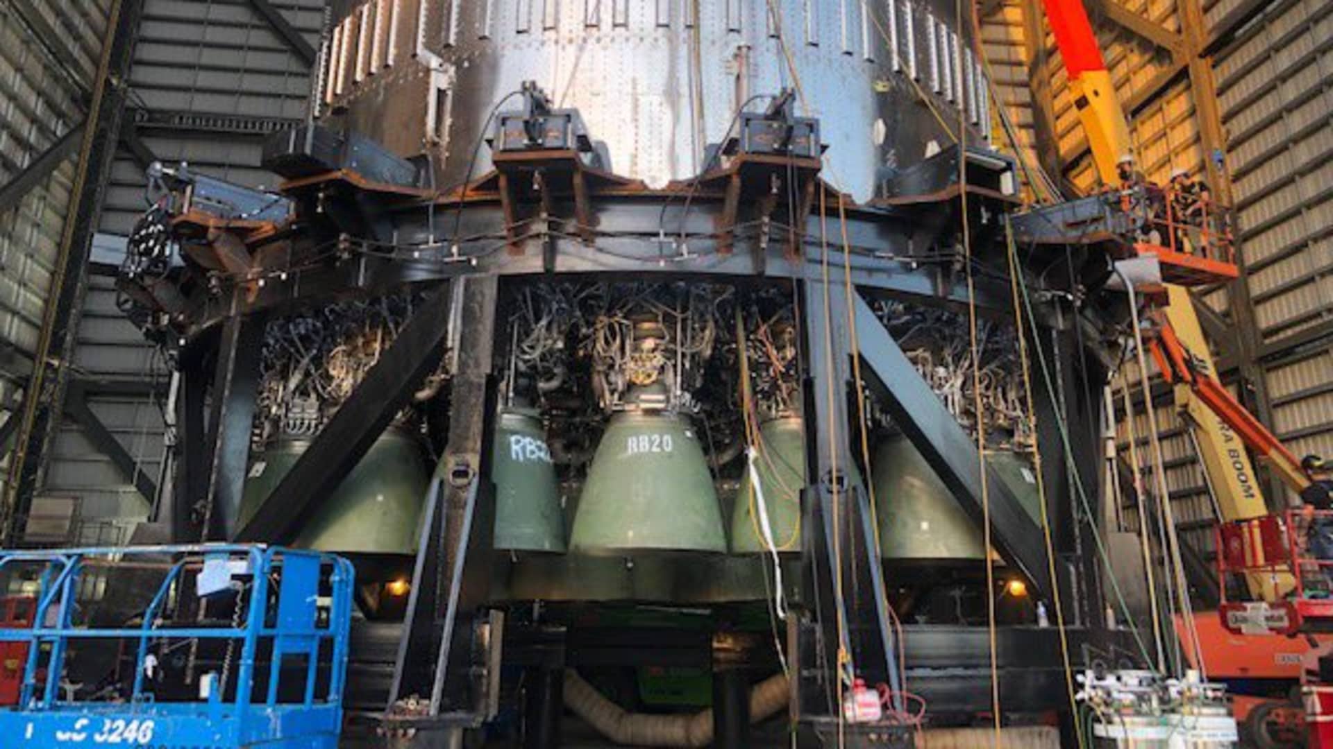 A look at the base of Super Heavy Booster 4 shortly after SpaceX engineers installed 29 Raptor rocket engines.