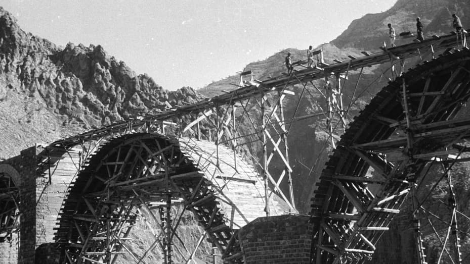 A railway bridge is constructed to form part of the Trans-Iranian Railway in 1956.