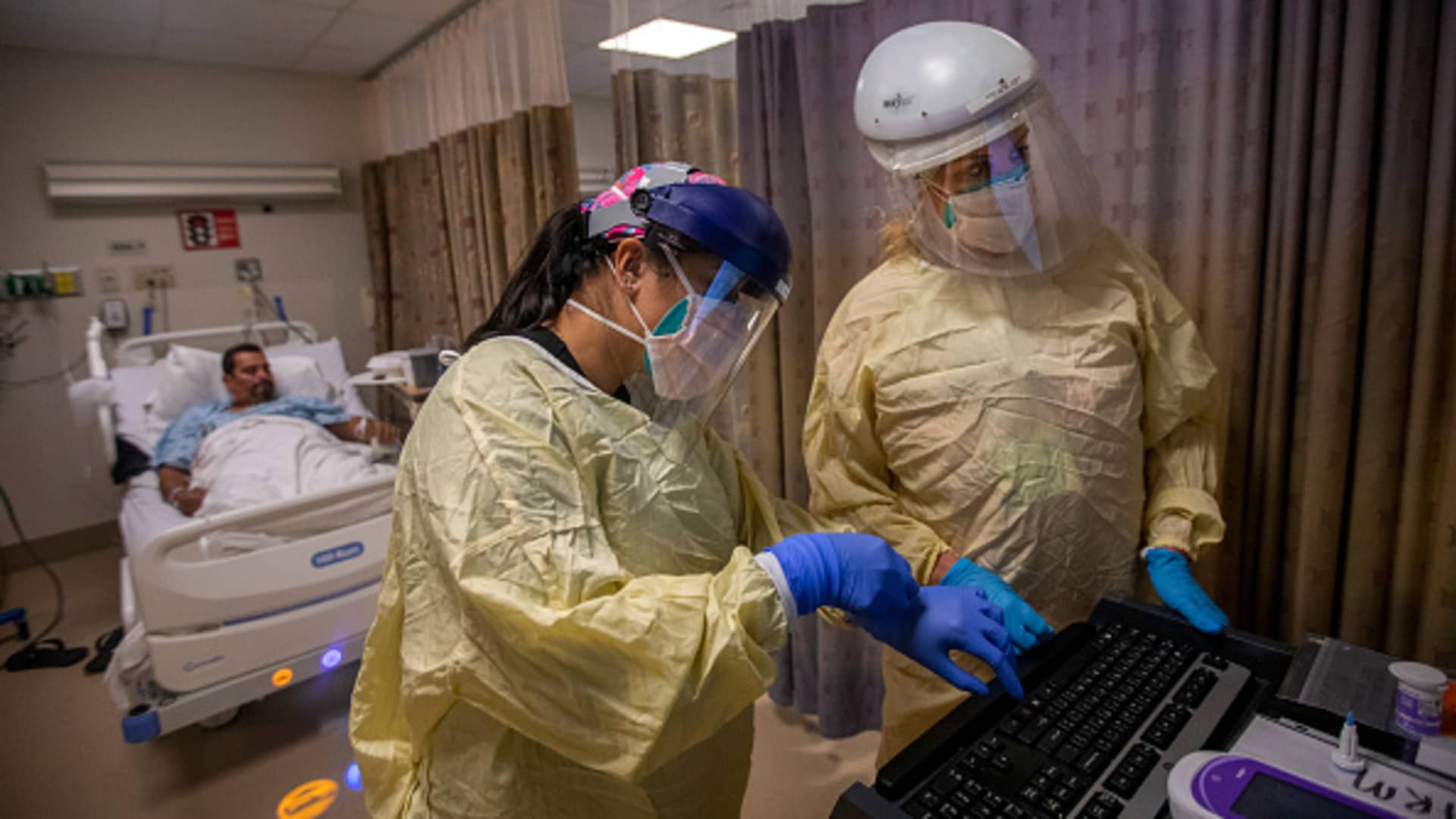 Kim Dimaunahan, RN, left, and Courtney Herron, RN, right, are working in the covid unit inside Little Company of Mary Medical Center Friday, July 30, 2021 in Torrance, CA.