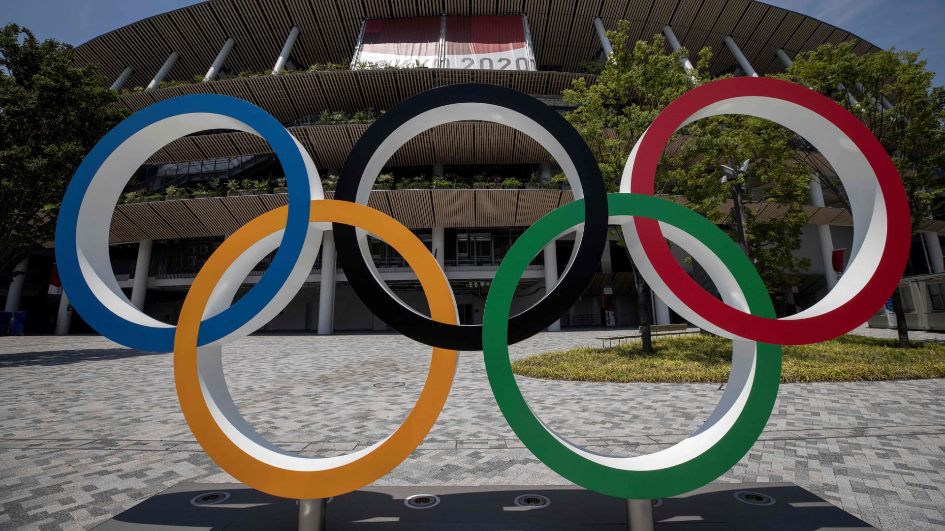 The Olympic rings standing in front of the Olympic Stadium in Tokyo on July 20, 2021 ahead of the Tokyo 2020 Olympic Games.