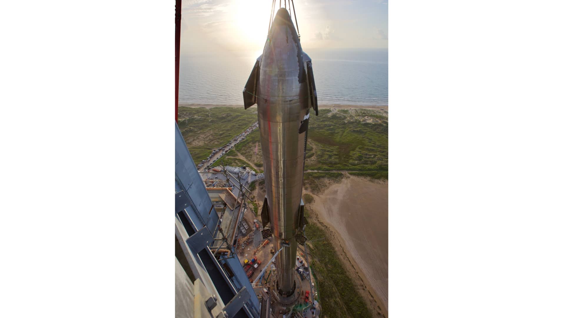 A view from the launch tower as SpaceX stacks Starship prototype 20 on top of Super Heavy rocket Booster 4 on August 6, 2021.