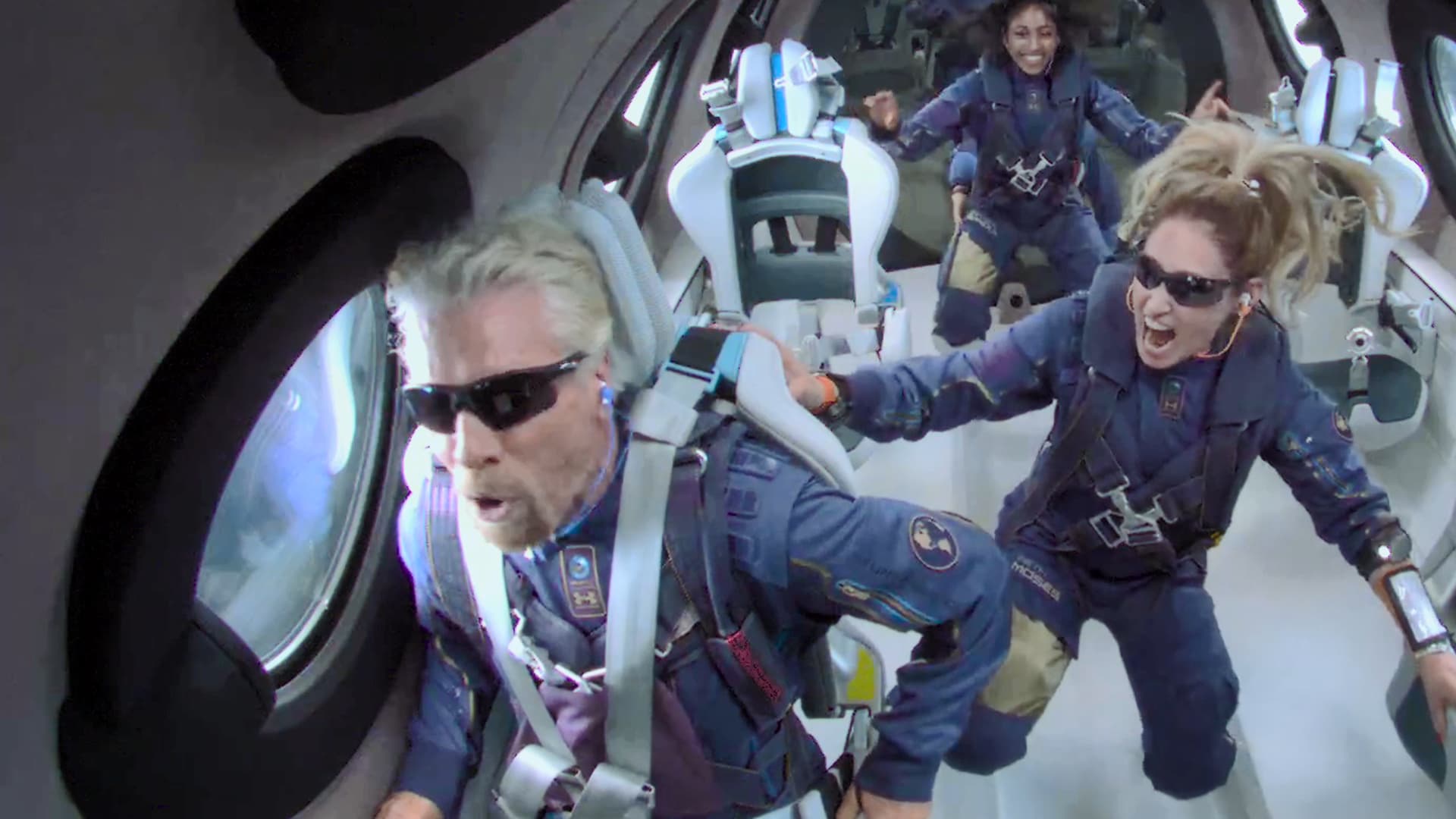 Sir Richard Branson, left, in space alongside mission specialists Sirisha Bandla and Beth Moses on July 11, 2021.
