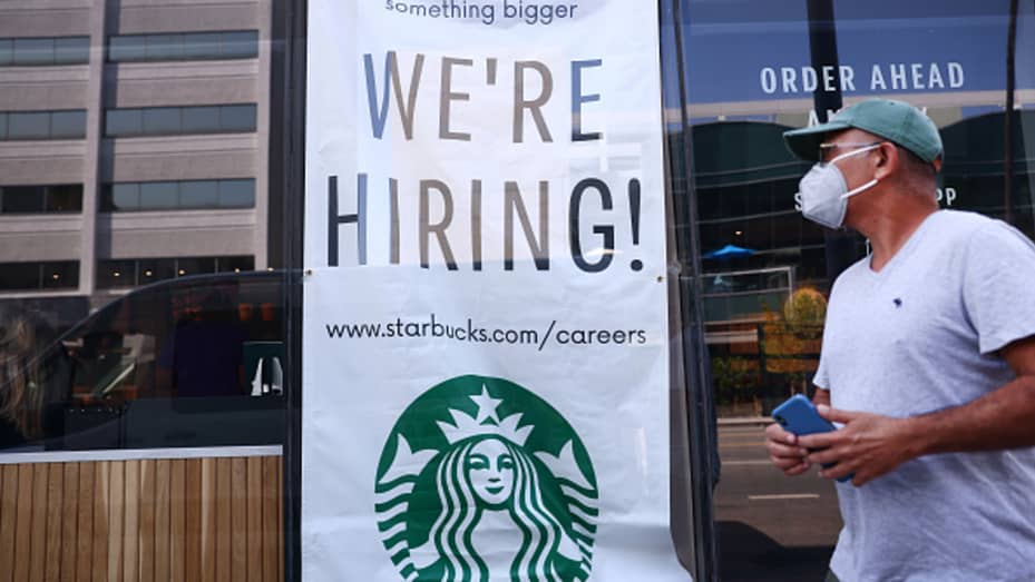 A 'We're Hiring!' sign is posted at a Starbucks on August 06, 2021 in Los Angeles, California.