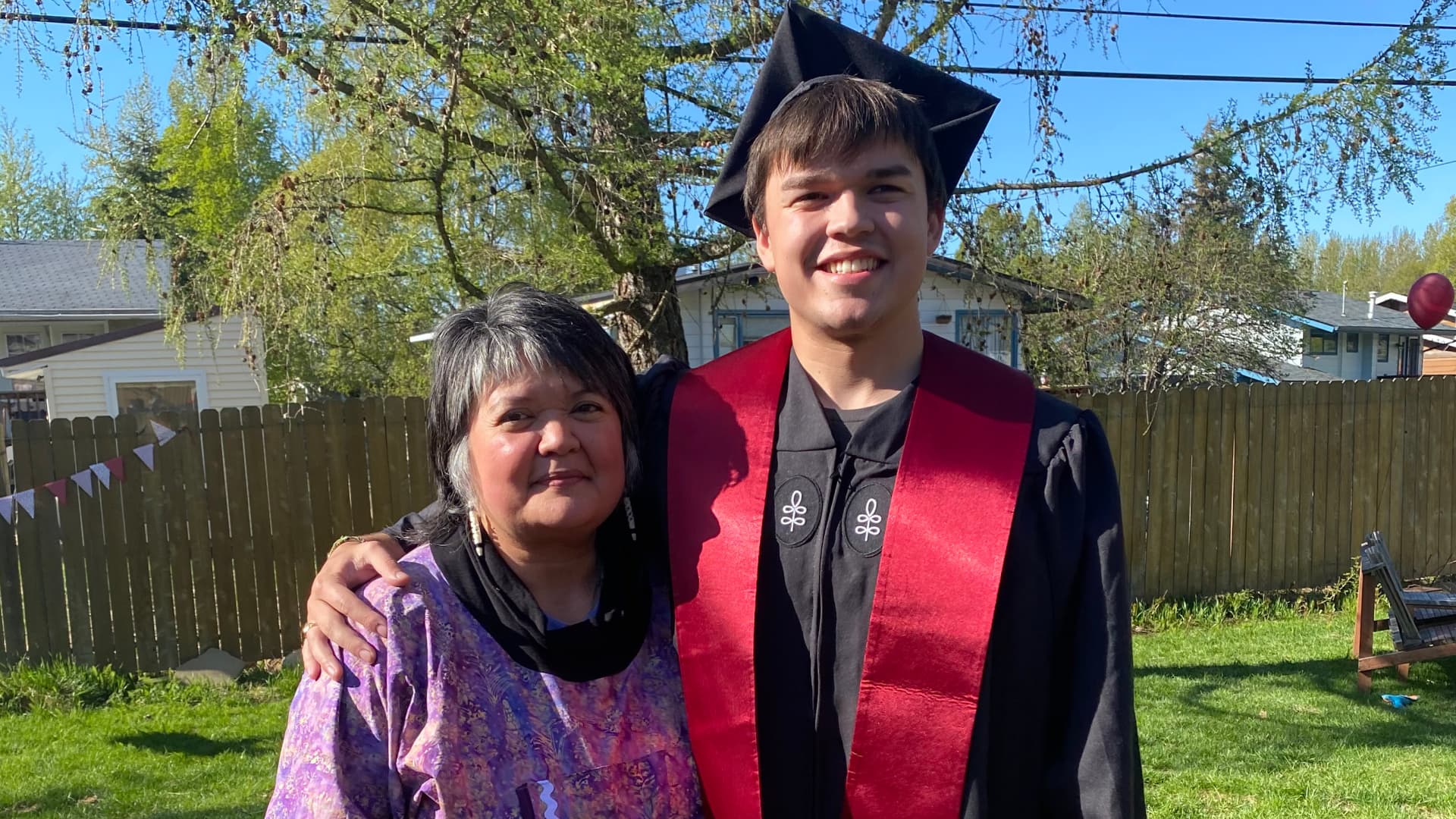 Brandon McIntire pictured with mom Karen is Yup'ik and Unangax̂ from Alaska. McIntire graduated from Harvard with a B.A. in sociology in May 2021.