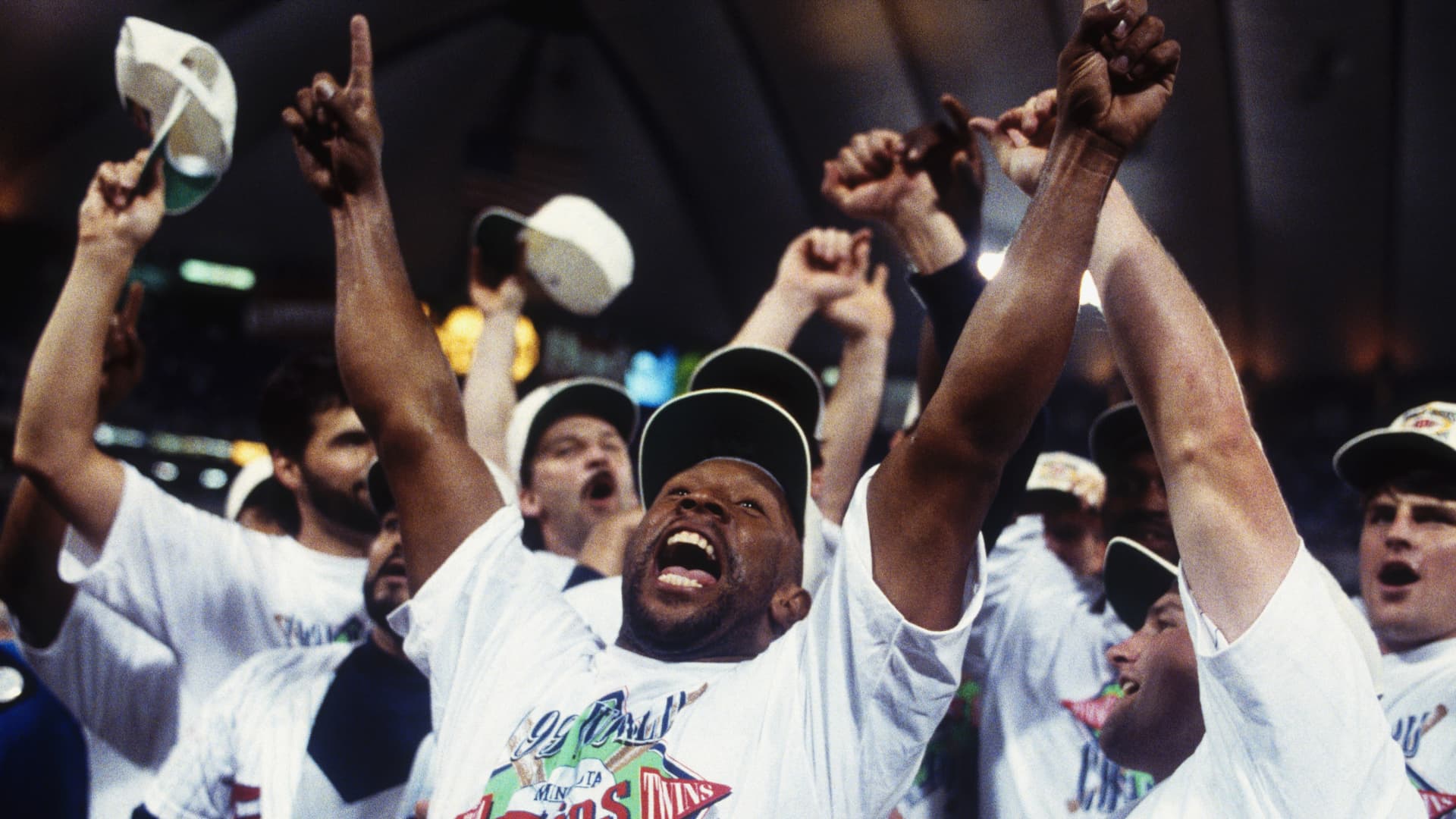 Outfielder Kirby Puckett #34 of the Minnesota Twins leads the cheers during the celebration after winning Game Seven of the World Series against the Atlanta Braves at the Metrodome on October 27, 1991 in Minneapolis, Minnesota.