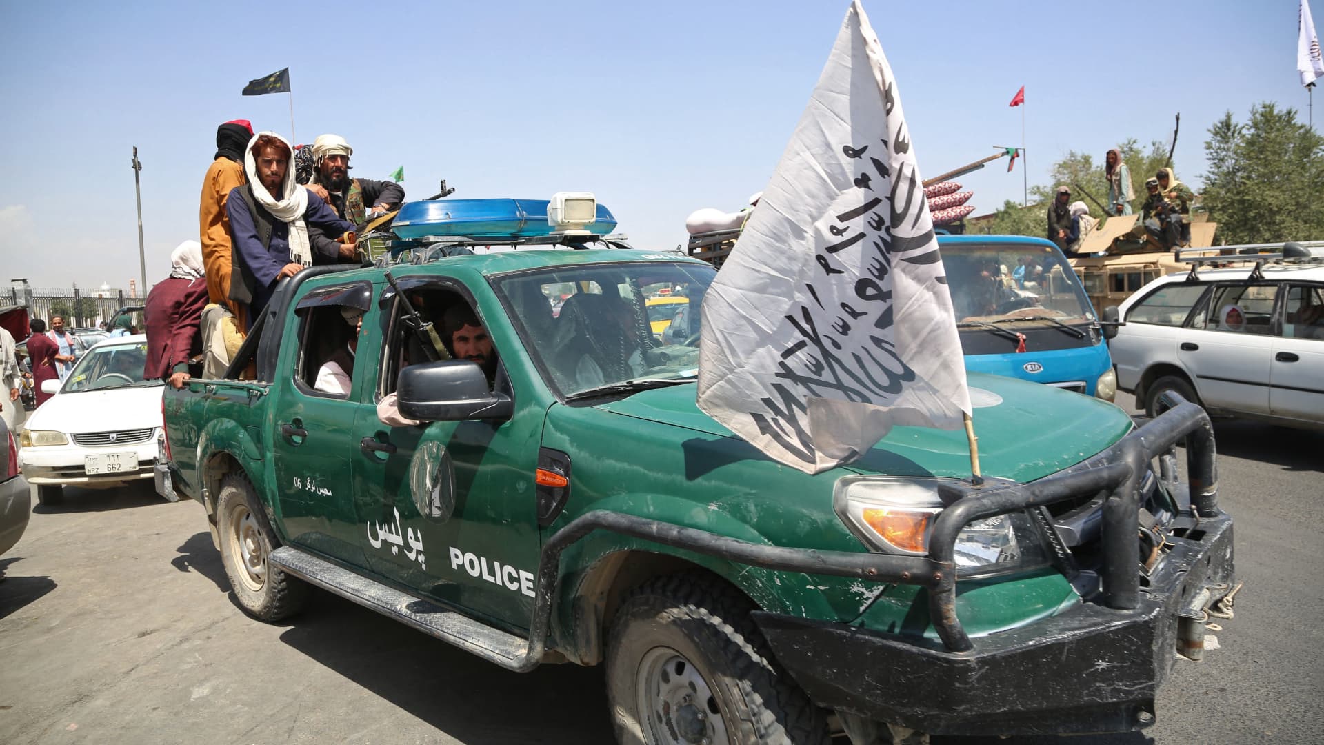 Taliban fighters patrol the streets of Kabul on August 16, 2021, after a stunningly swift end to Afghanistan's 20-year war, as thousands of people mobbed the city's airport trying to flee the group's feared hardline brand of Islamist rule.