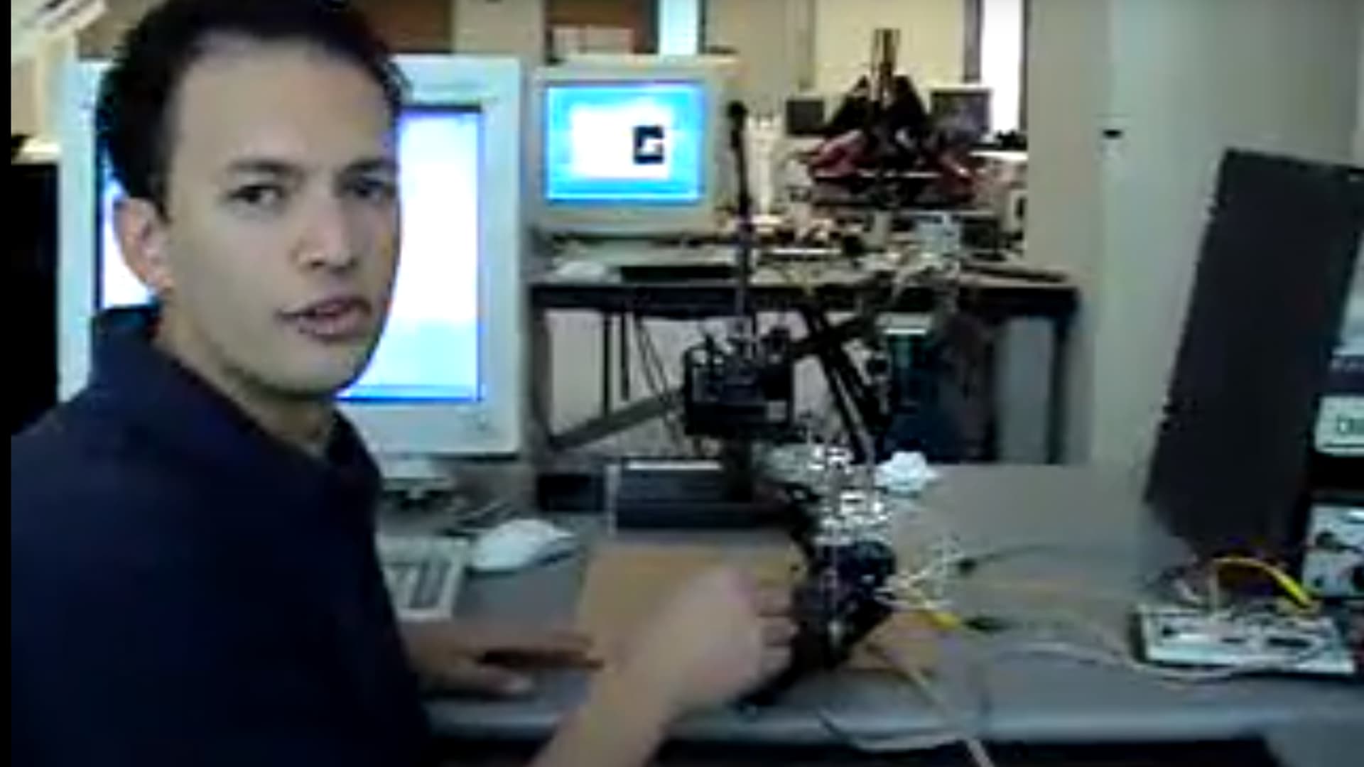 Selinger, in college, presenting a force-feedback robot research project at Stanford's robotics lab.