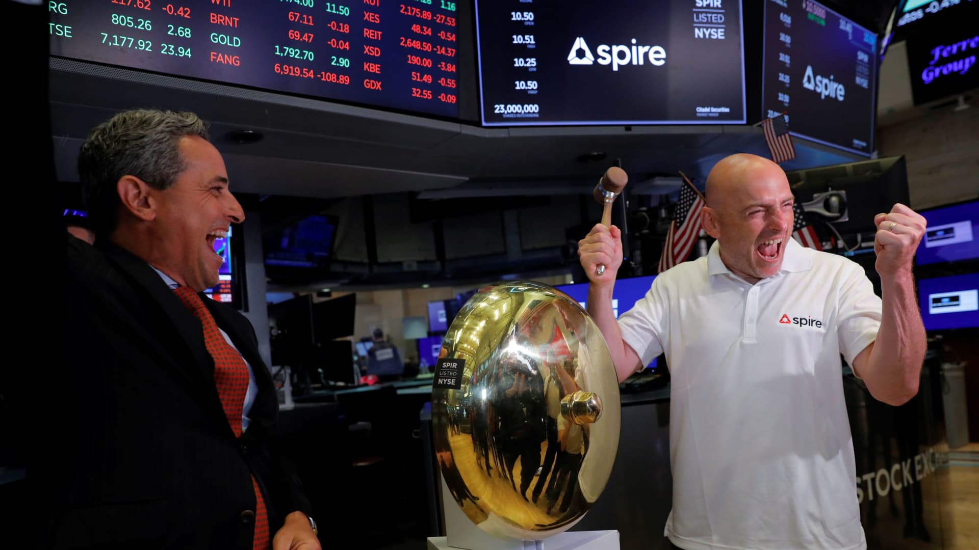 Spire CEO Peter Platzer poses with a ceremonial bell at the New York Stock Exchange (NYSE) during their listing in Manhattan, New York City, U.S., August 17, 2021.