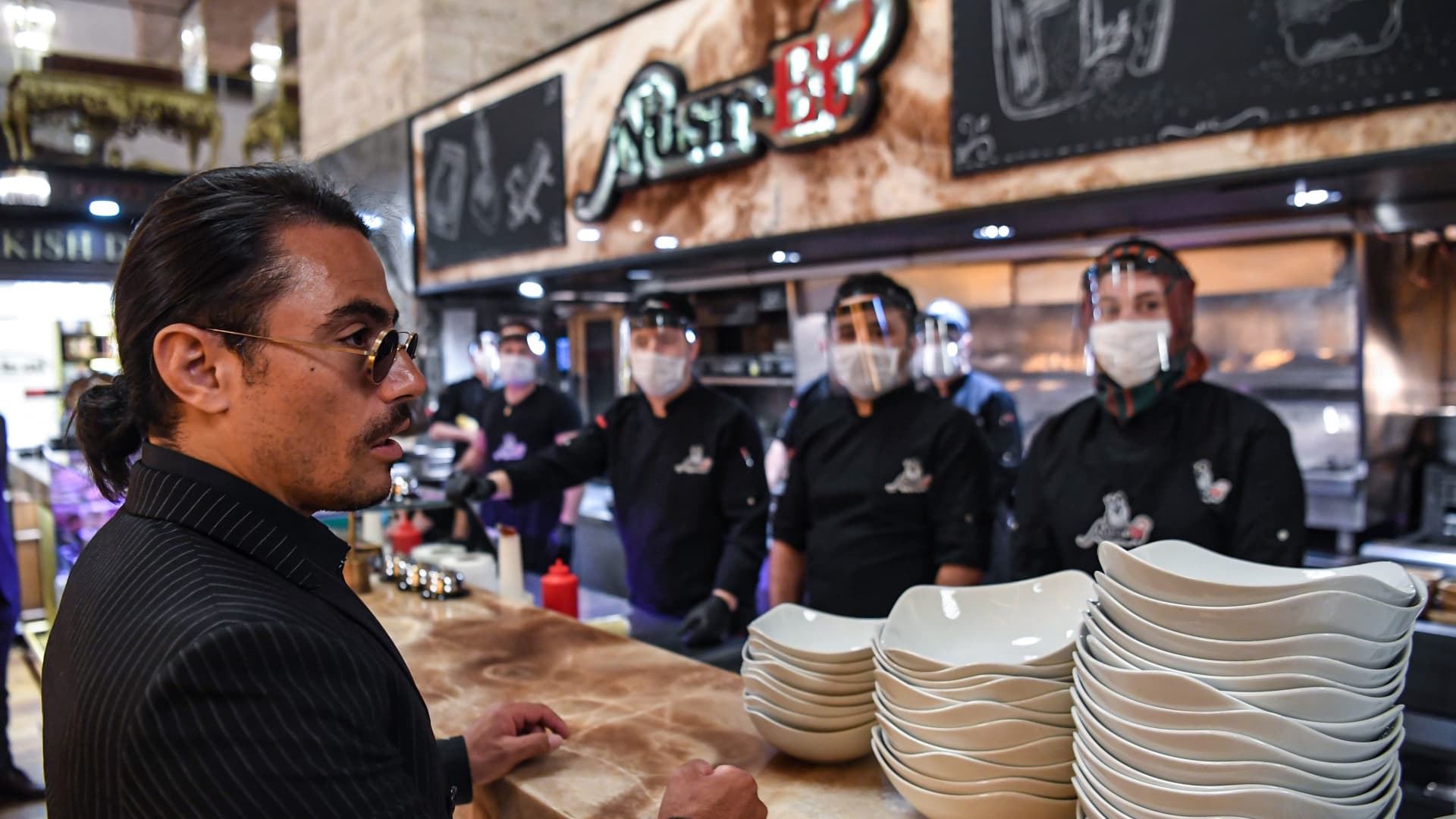 Turkish restaurateur Nusret Gokce, also known as 'Salt Bae', speaks to his staff at his restaurant 'Nusr-Et' at the Grand Bazaar after its reopening on June 1, 2020 in Istanbul.