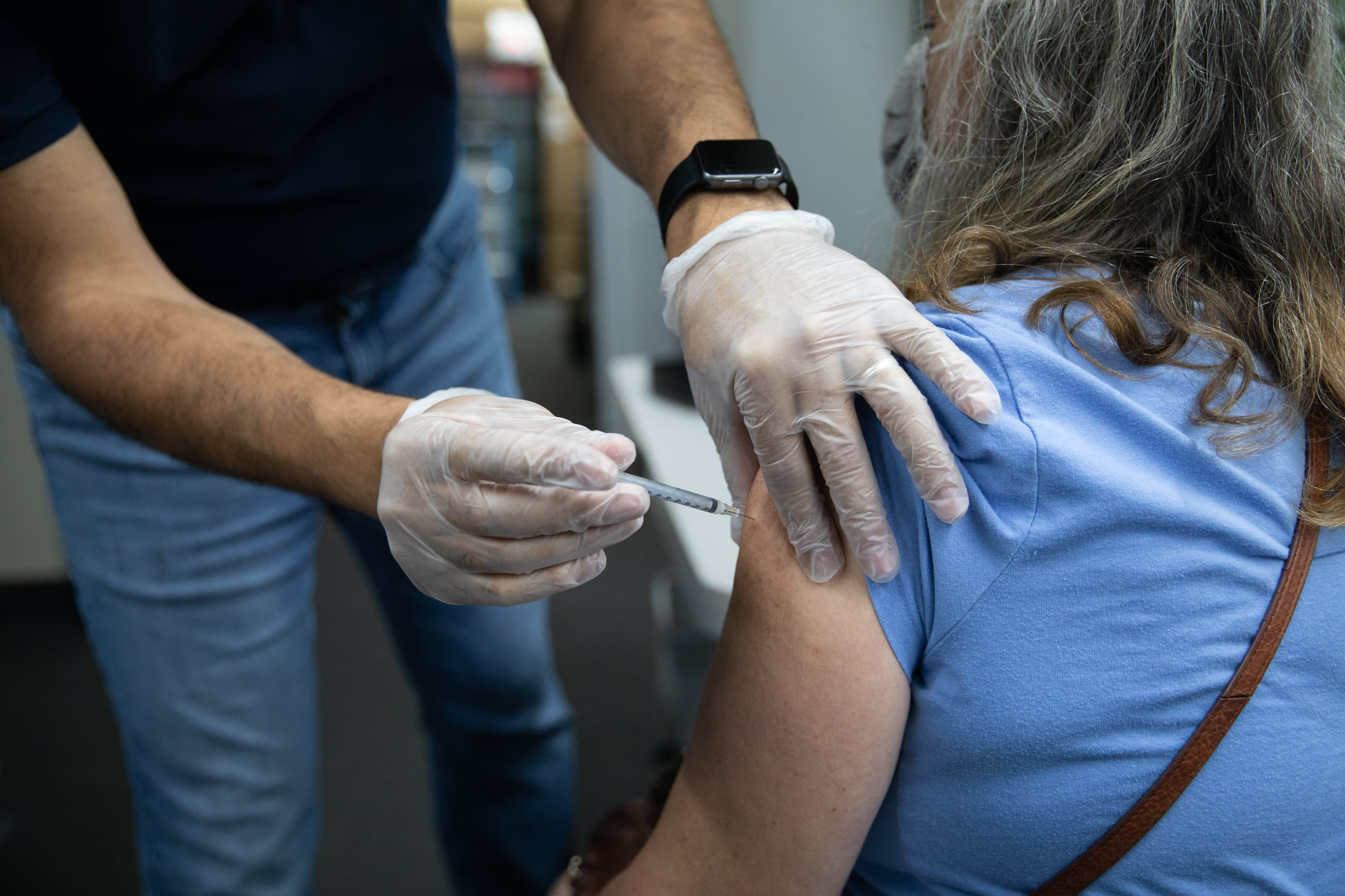 The United States will begin widely distributing Covid-19 booster shots next month as new data shows that vaccine protection wanes over time, top U.S.