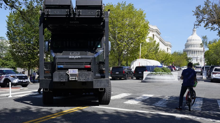 A police vehicle moves into an area near the U.S. Capitol and a Library of Congress building in Washington on Thursday, Aug. 19, 2021, as law enforcement officials investigate a report of a pickup truck containing an explosive device.