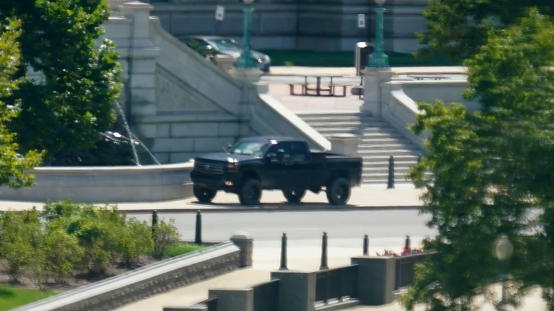 A pickup truck is parked on the sidewalk in front of the Library of Congress' Thomas Jefferson Building, as seen from a window of the U.S. Capitol, Thursday, Aug. 19, 2021, in Washington.