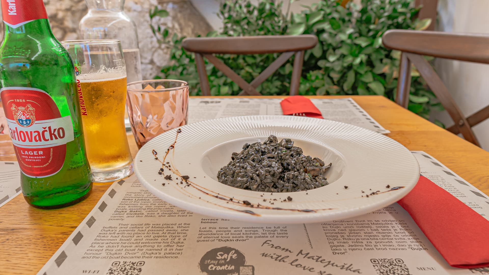 Squid ink risotto and a beer from Dujkin Dvorlocal, a local restaurant in Split, for just under $18.