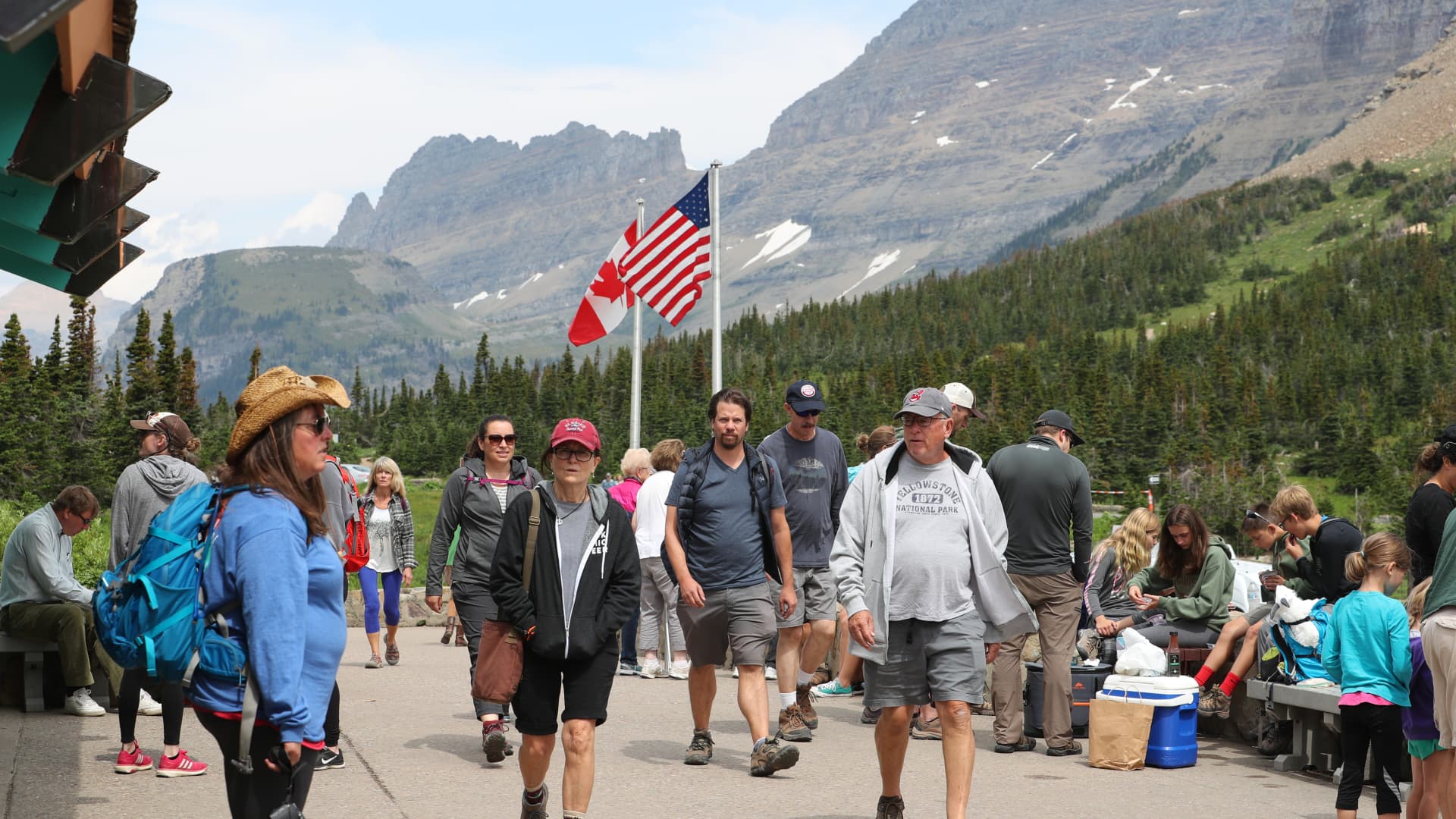 Visitors walk around the Logan Pass Visitor Center in Glacier National Park on July 26, 2018 in West Glacier, Montana.