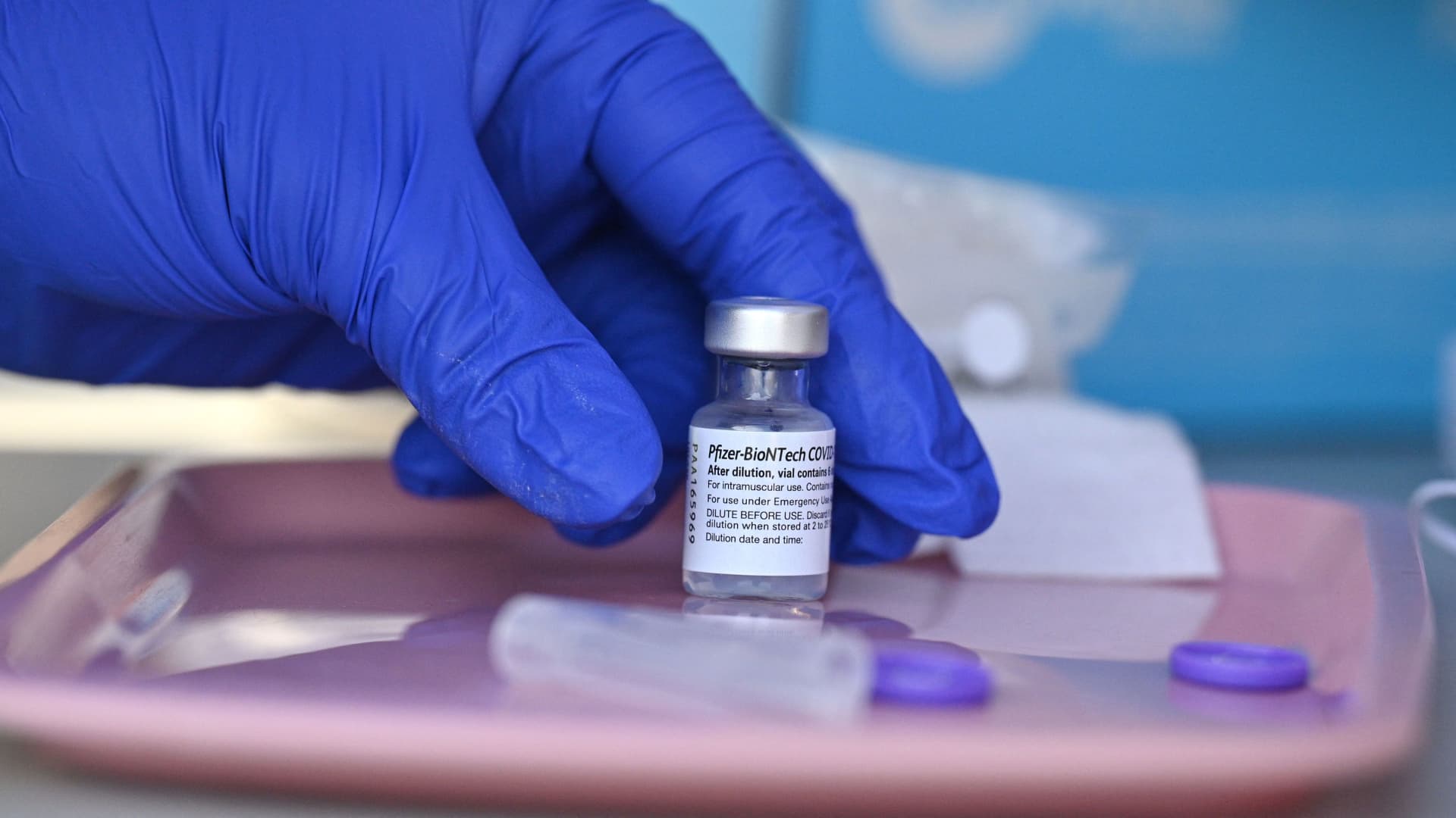 A nurse reaches for a vial of Pfizer-BioNTech Covid-19 vaccine at a pop up vaccine clinic in the Arleta neighborhood of Los Angeles, California, August 23, 2021.