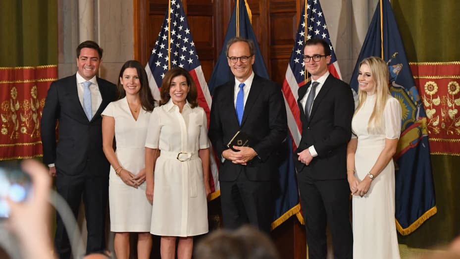 New York Governor Kathy Hochul (R) together with her husband William J. Hochul Jr. and family members poses during her swearing in ceremony at the New York State Capitol in Albany, New York on August 24, 2021.