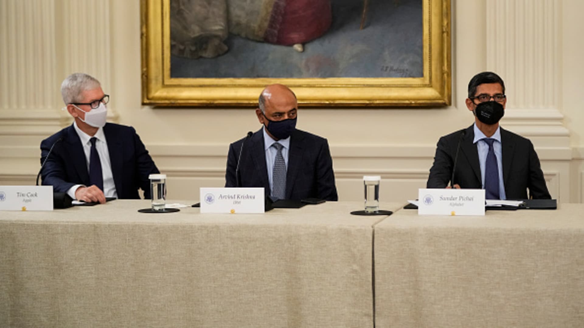 (L-R) Apple CEO Tim Cook, IBM CEO Arvind Krishna and Google CEO Sundar Pichai listen as U.S. President Joe Biden speaks during a meeting about cybersecurity in the East Room of the White House on August 25, 2021 in Washington, DC.