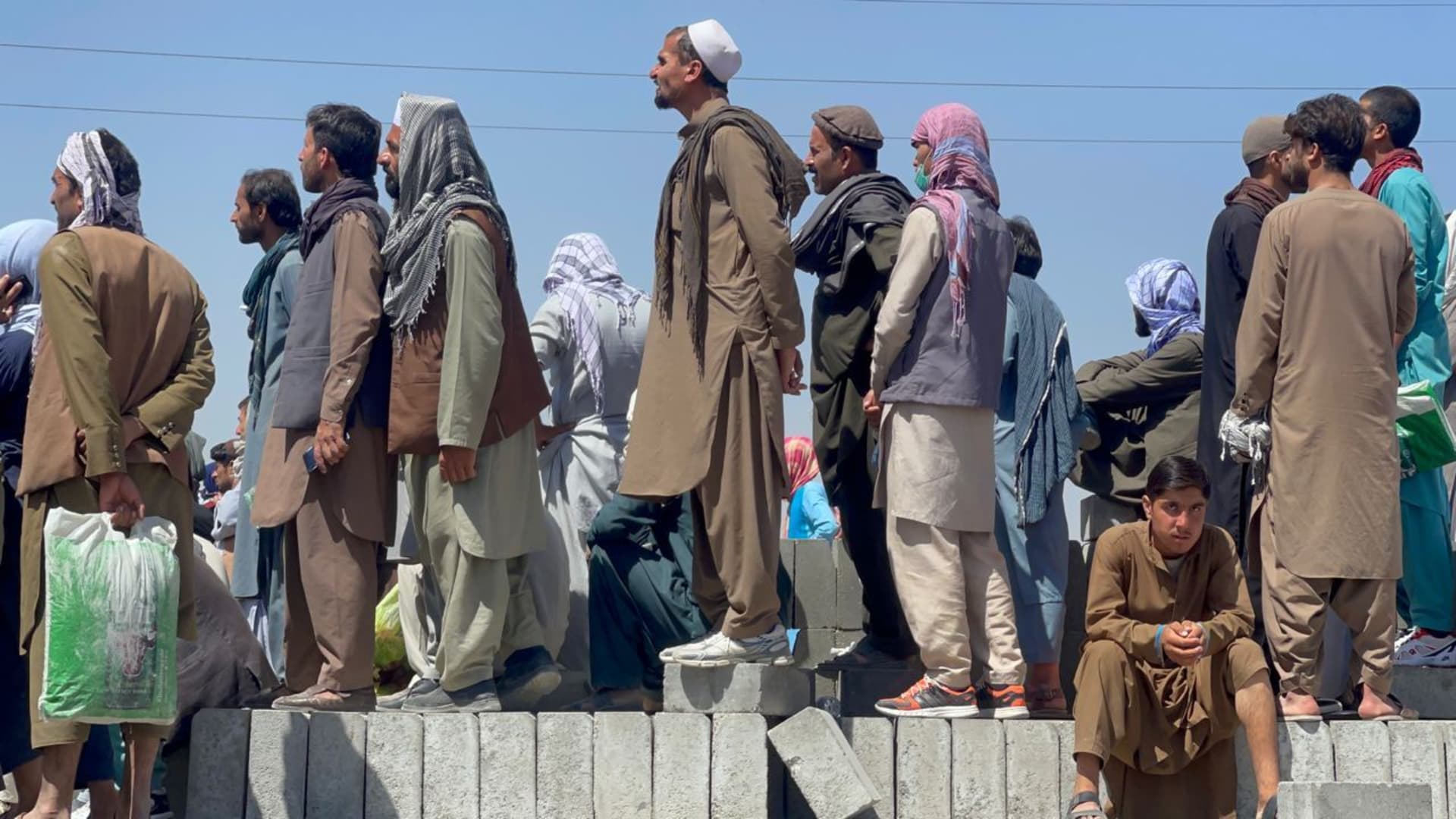 Afghan people who want to leave the country continue to wait around Hamid Karzai International Airport in Kabul, Afghanistan on August 26, 2021.
