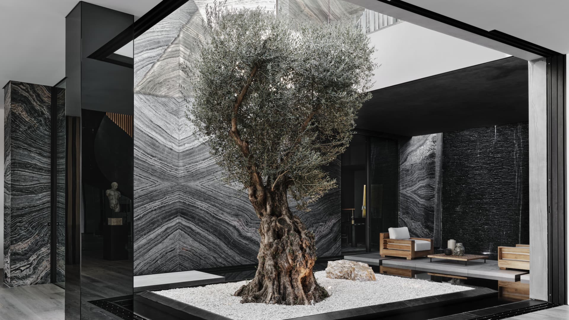 The home's interior courtyard features a 150-year-old olive tree.