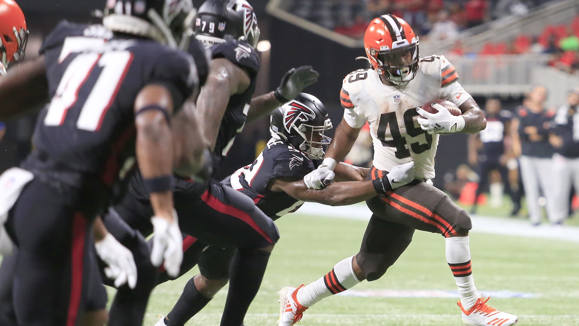 Running back John Kelly #49 of the Cleveland Browns escapes the Falcons defense during the final preseason NFL game between the Cleveland Browns and the Atlanta Falcons on August 29, 2021 at the Mercedes-Benz Stadium in Atlanta, Georgia.