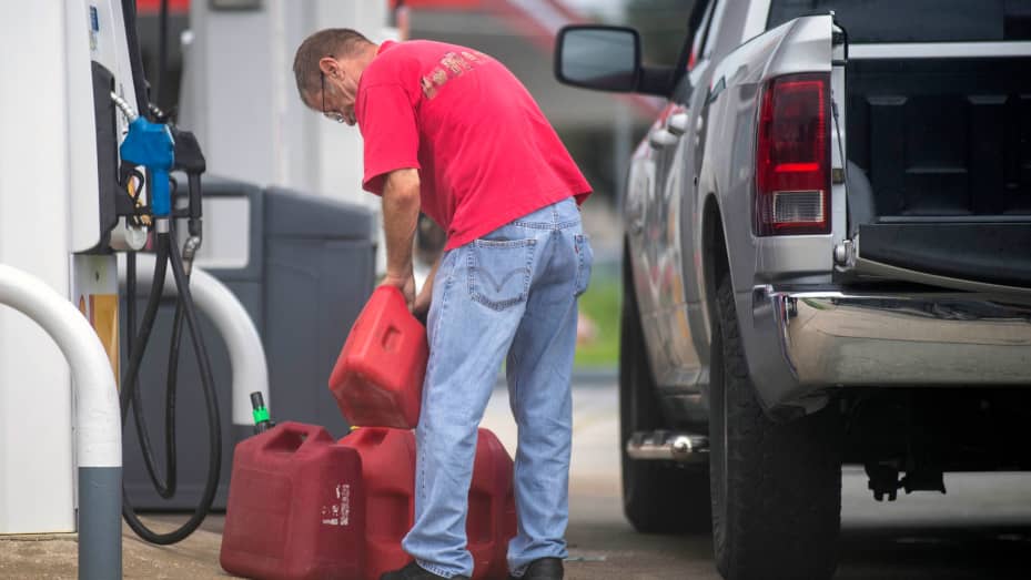 St. Bernard Parish residents fill up their cars and gas cans as the Louisiana coast prepares for the arrival of Hurricane Ida on Friday, Aug. 27, 2021 in New Orleans.