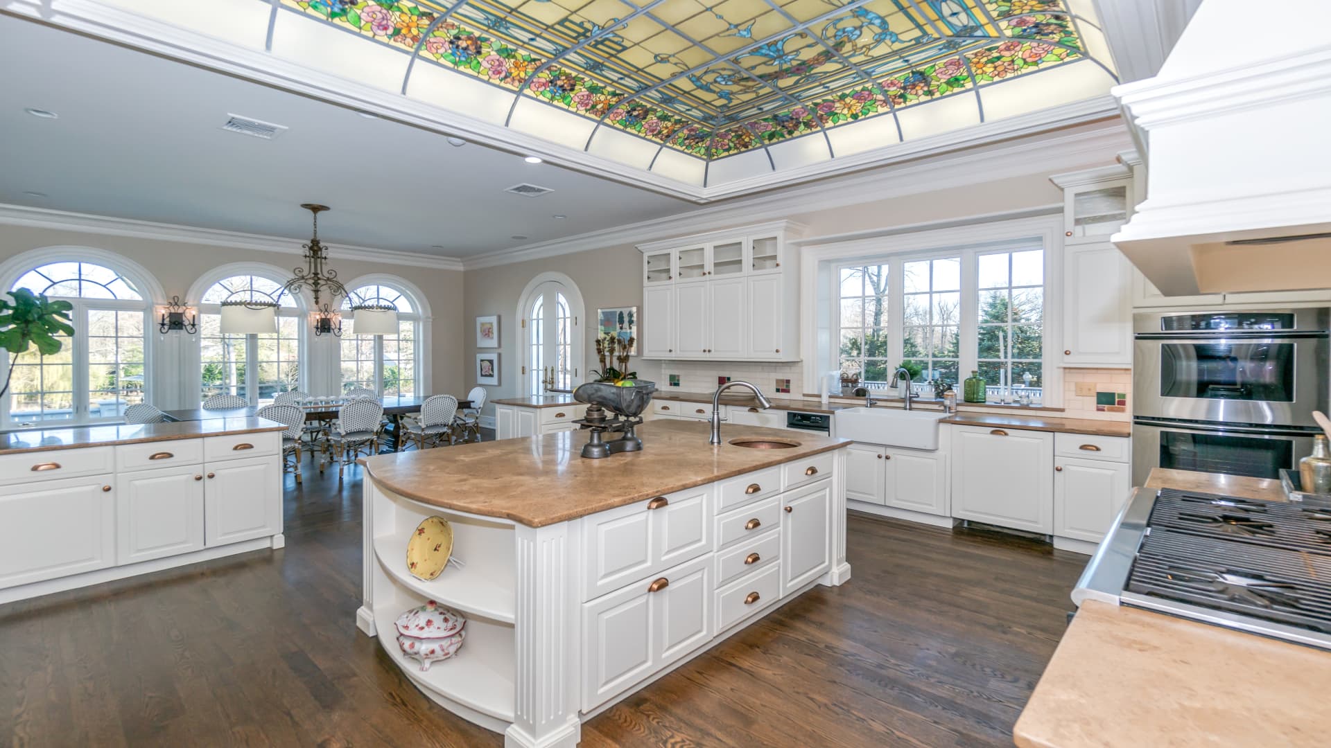 A recently updated kitchen includes colorful stained glass built into the ceiling.
