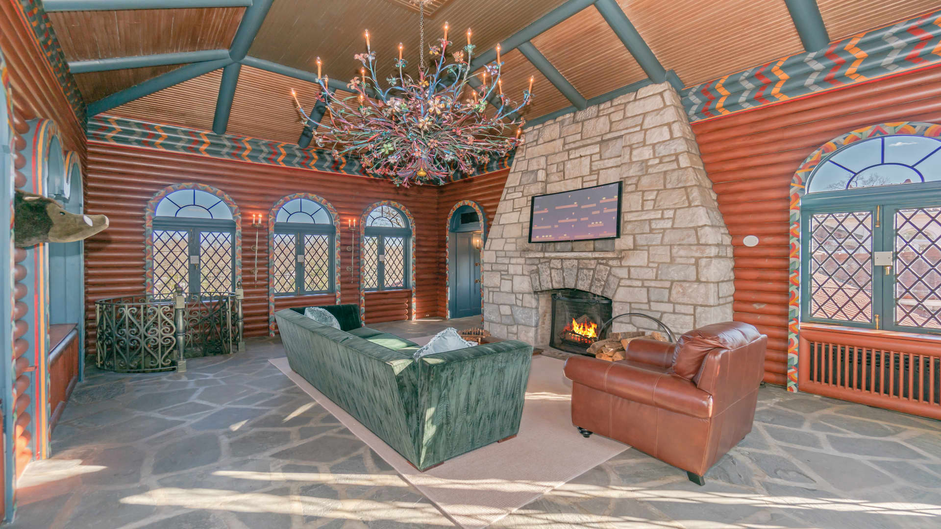 A sitting area and stone fireplace in one of the home's 28 rooms.