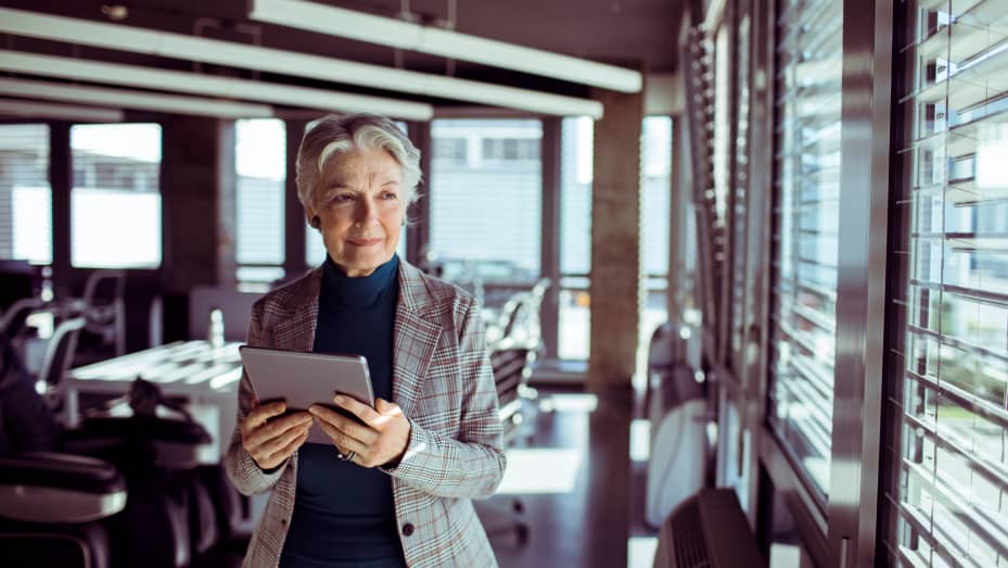 Close up of a senior businesswoman using a tablet in the office