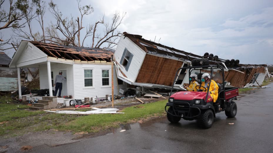A search and rescue team from Texas works outside a home destroyed by Hurricane Ida September 1, 2021 in Golden Meadow, Louisiana.