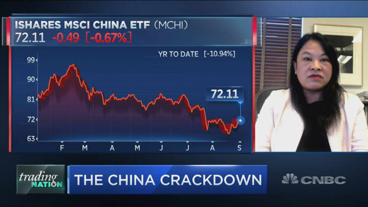 Investors should consider buying China bonds over its stocks right now, J.P. Morgan Joyce Chang says