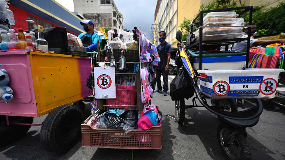 Street vendors in San Salvador with anti-bitcoin stickers.