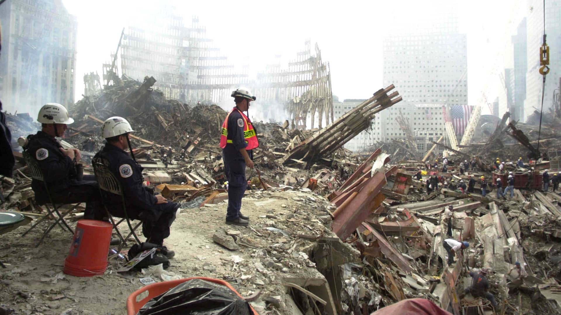 Rescue workers sift through debris at the ground Zero of what remains of the World Trade Center twin towers site, September 24, 2001.