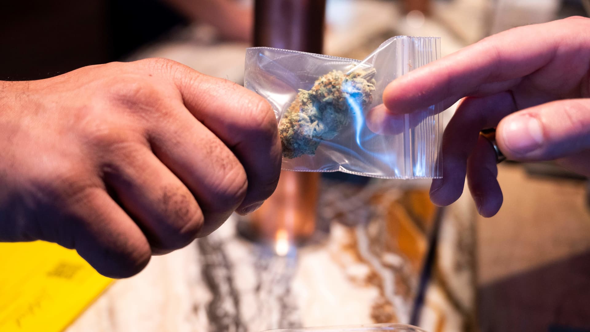 A customer buys marijuana in a coffee shop in the city centre of Amsterdam on January 8, 2021. -