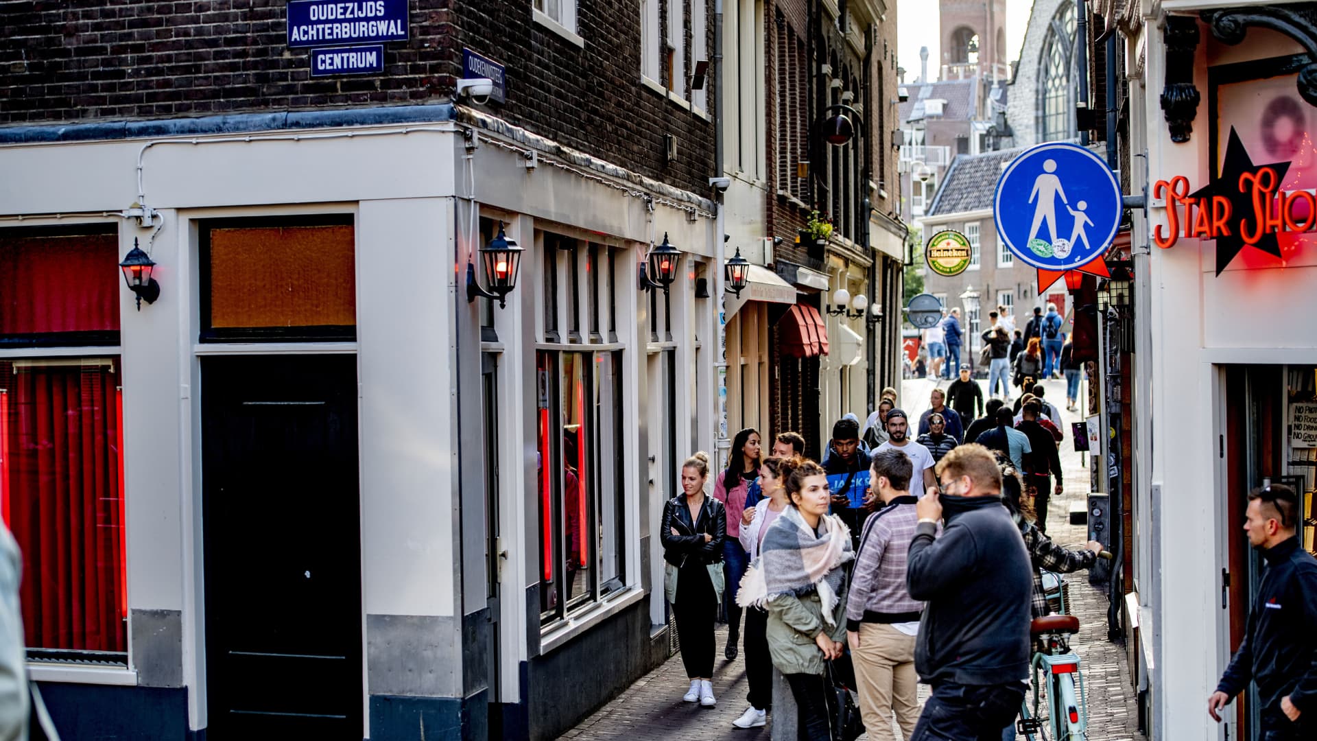 Tourists visit the Red-light district in Amsterdam