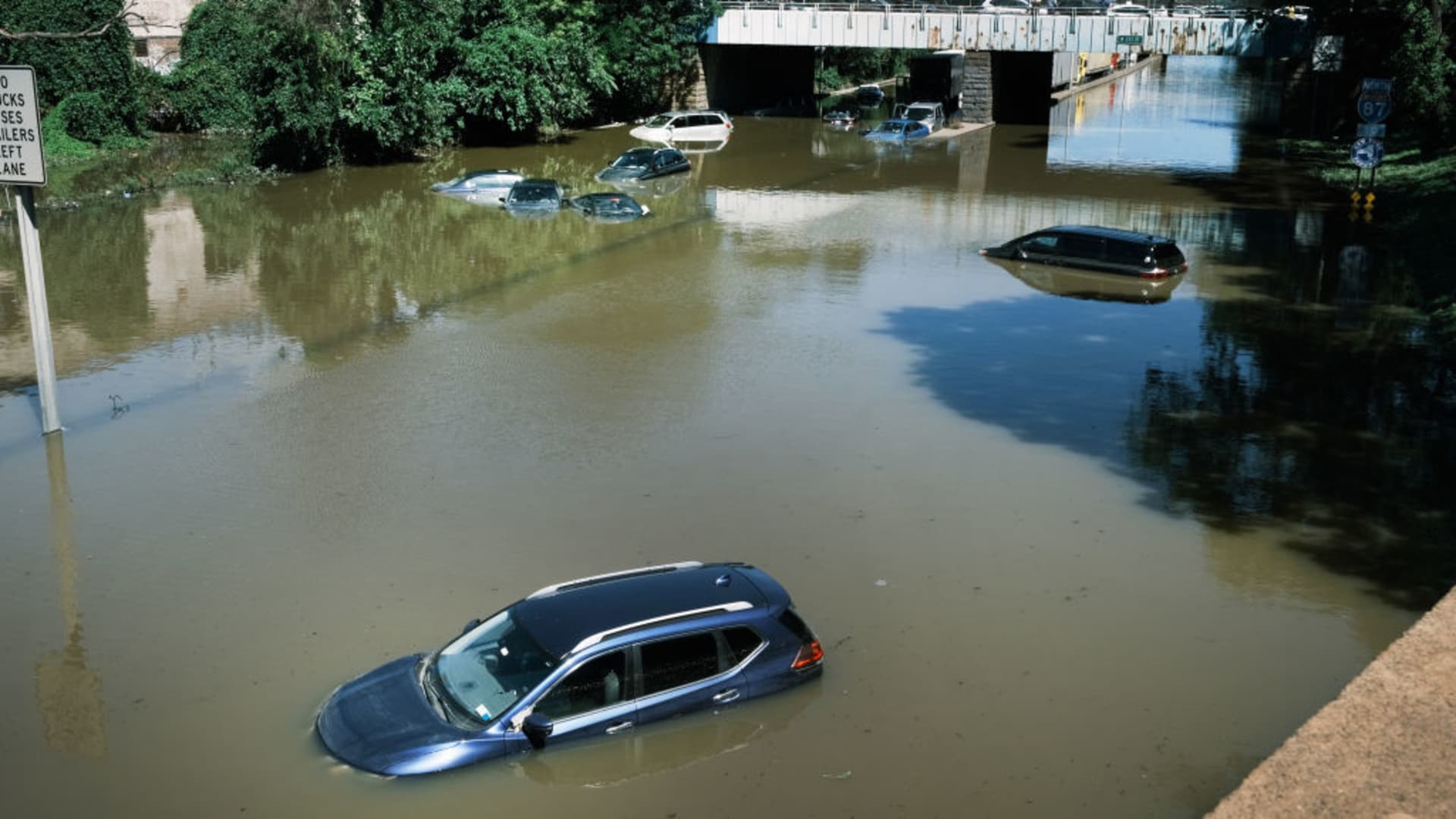 Cars sit abandoned on the flooded Major Deegan Expressway following a night of extremely heavy rain from the remnants of Hurricane Ida on September 2, 2021 in the Bronx borough of New York City.