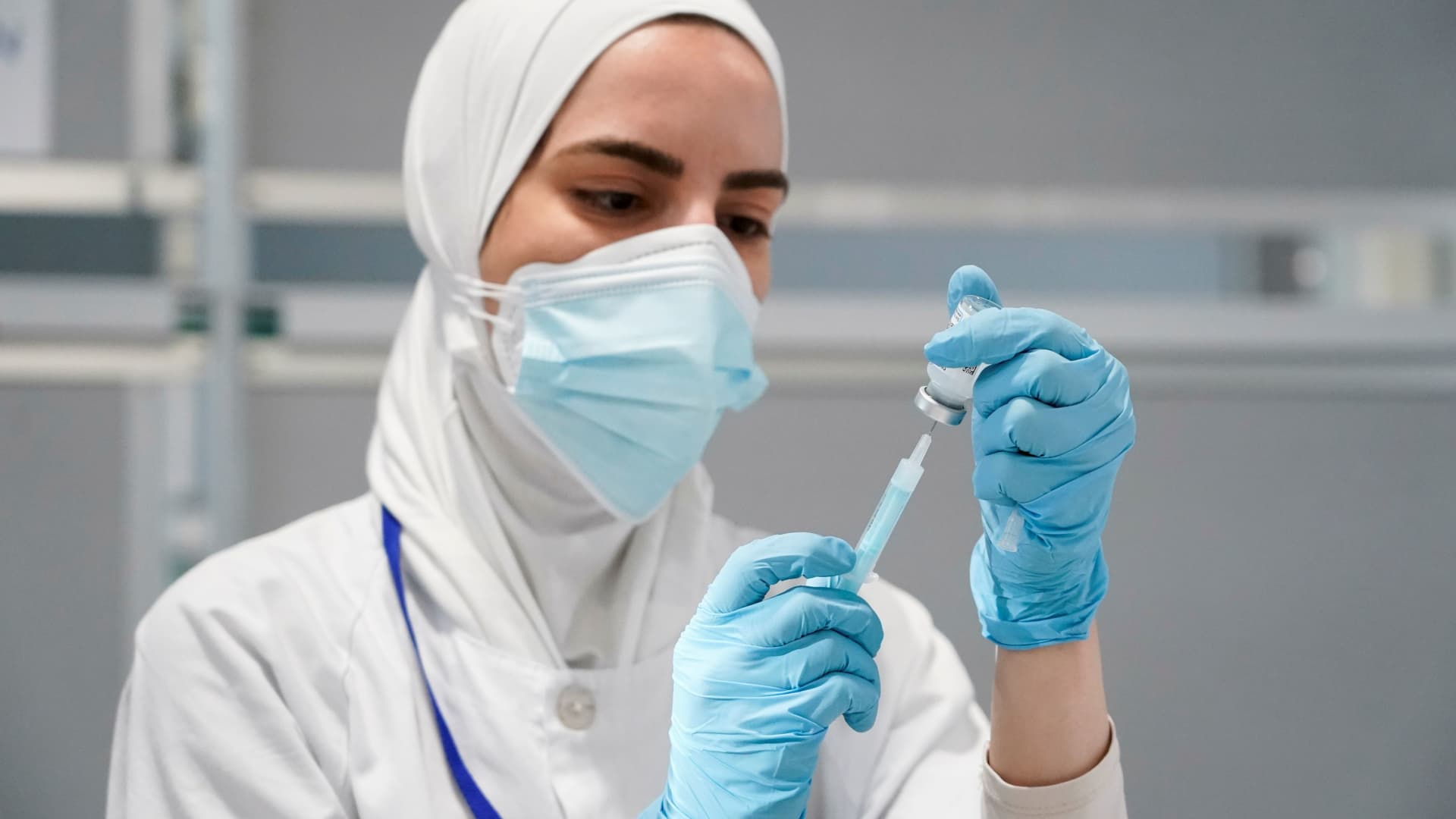 A nurse prepares a syringe with a dose of the Moderna coronavirus disease (COVID-19) vaccine at Enfermera Isabel Zendal hospital in Madrid, Spain, July 23, 2021.