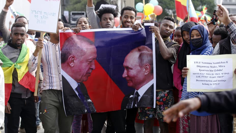 ADDIS ABABA, Ethiopia - August 8, 2020: Ethiopians hold up a poster of Russian President Vladimir Putin and Turkish President Recep Tayyip Erdogan during a pro-government gathering condemning the rebel Tigray People's Liberation Front (TPLF).