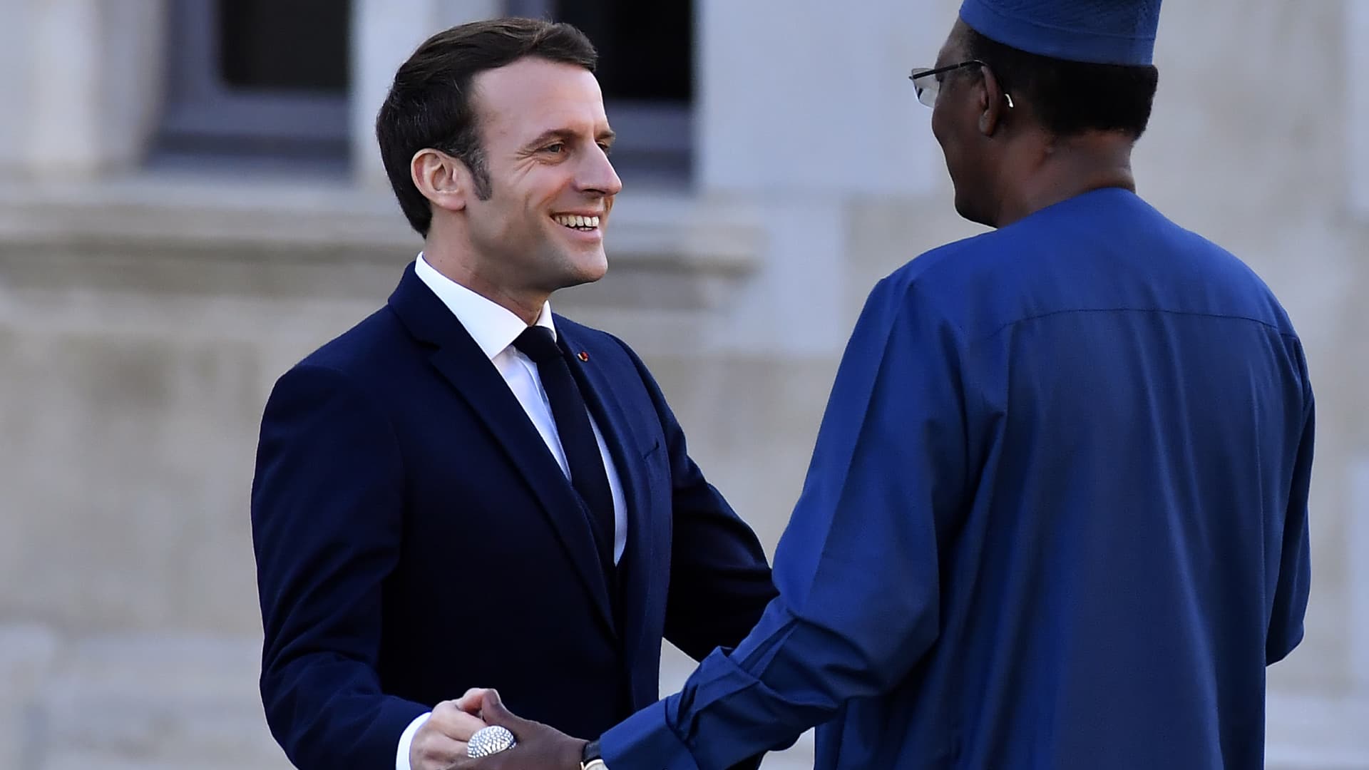 PAU, France - French President Emmanuel Macron (L) welcomes Chad's President Idriss Deby prior to a summit on the situation in the Sahel region in the southern French city of Pau on January 13, 2020.