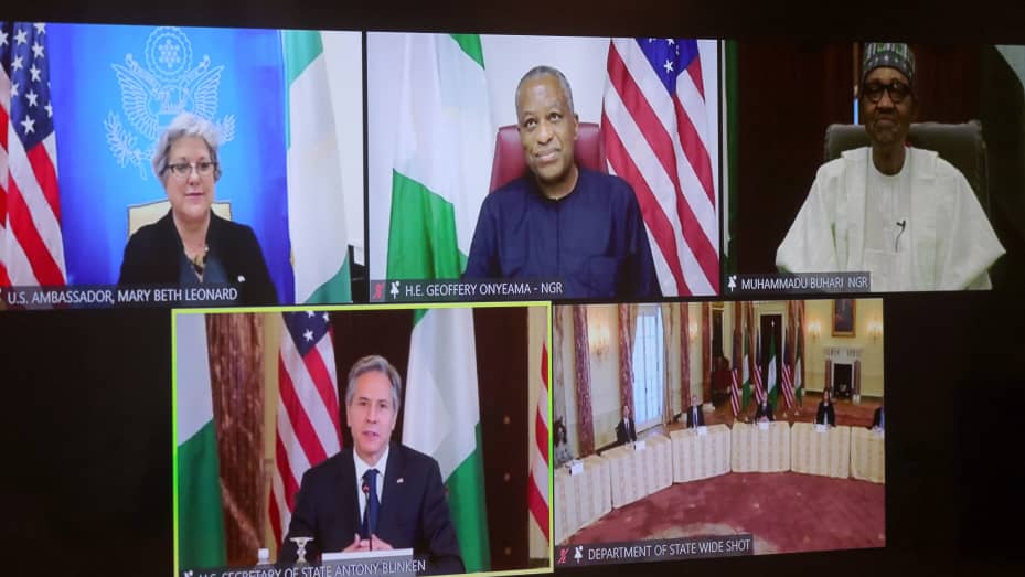 US Secretary of State Antony Blinken and staff members participate in a virtual bilateral meeting with Nigeria's President Muhammadu Buhari during a videoconference at the State Department in Washington, DC on April 27, 2021.