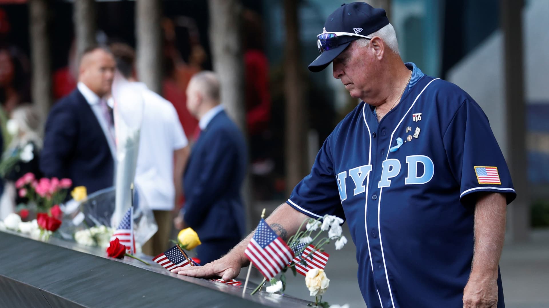 A man mourns at the 9/11 Memorial on the 20th anniversary of the September 11 attacks in Manhattan, New York City, U.S., September 11, 2021.