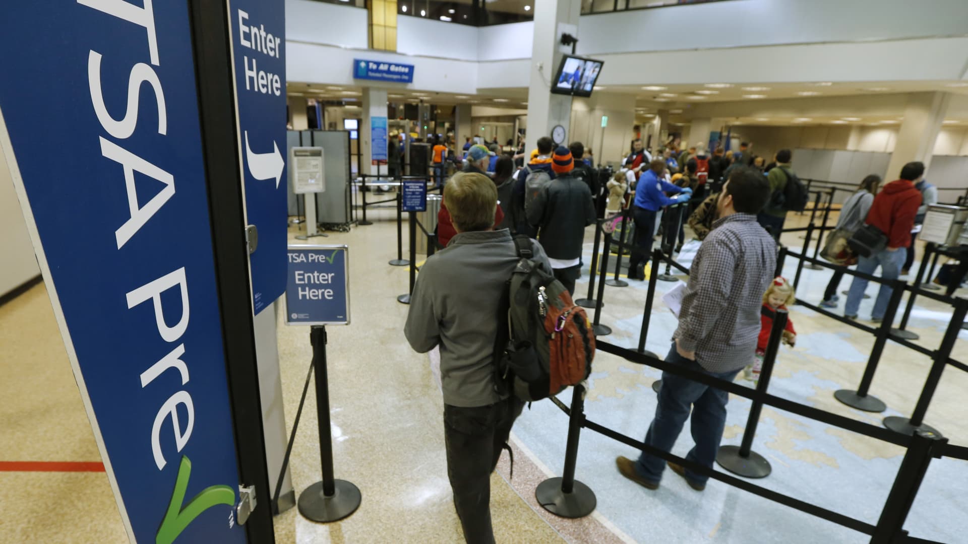 A passenger enters the Transportation Security Administration (TSA) pre-check line towards a security check point at Salt Lake City International Airport in Salt Lake City, Utah, U.S., on Tuesday, Dec. 23, 2014.