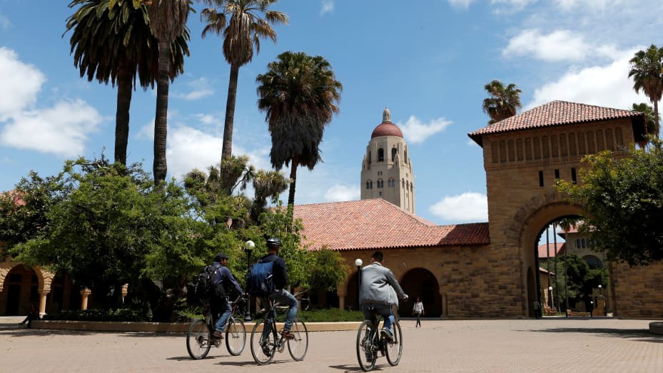 Cyclists traverse the main quad on Stanford University's campus in Stanford, California.